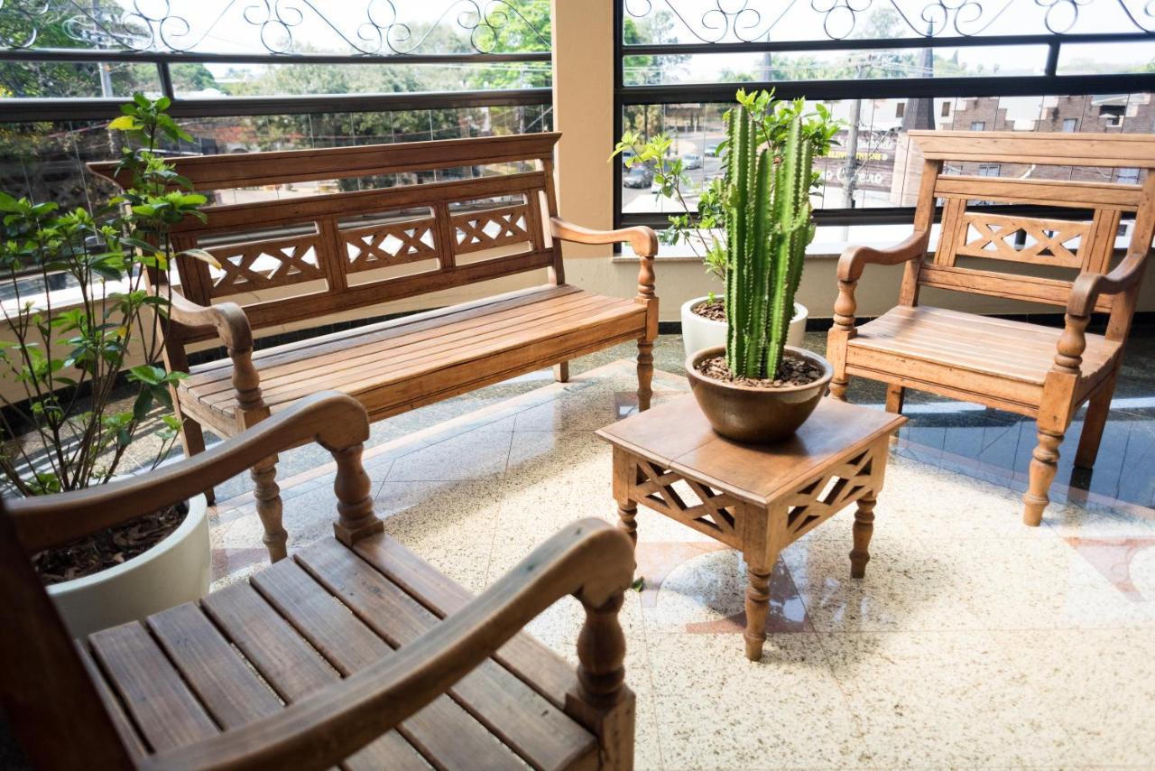 Holambra Garden Hotel Exterior photo A set of Thai style wooden furniture
